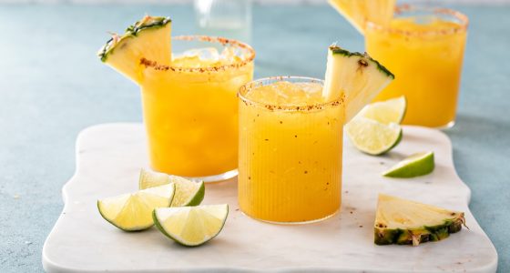 Pineapple,Margarita,Cocktail,In,Glasses,With,Chili,Tajin,Rim,And