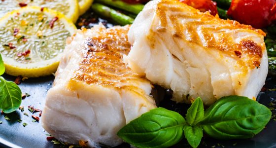 Fish,Dish, ,Fried,Cod,Fillet,With,Asparagus,On,Wooden